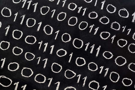 The numbers zero and one, written on a blackboard, binary system