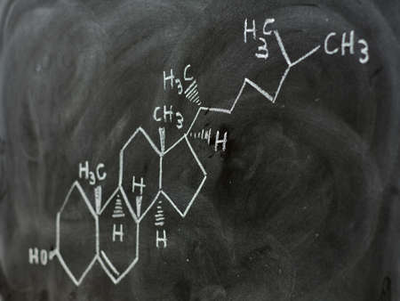 Molecular and structural formula of cholesterol written on a blackboardの写真素材