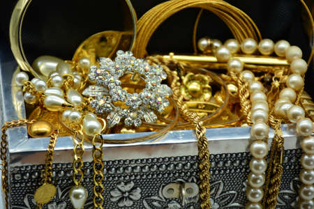Treasure, chest full of jewels, pearls, diamonds, trinkets and goldの写真素材