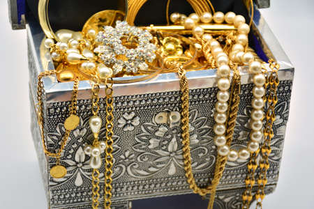 Treasure, chest full of jewels, pearls, diamonds, trinkets and goldの写真素材