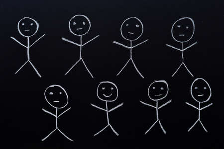 Group of puppets drawn by hand with chalk on a blackboardの写真素材