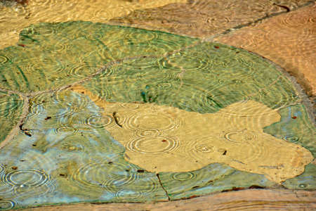 Abstract forms of water at the bottom of a fountain