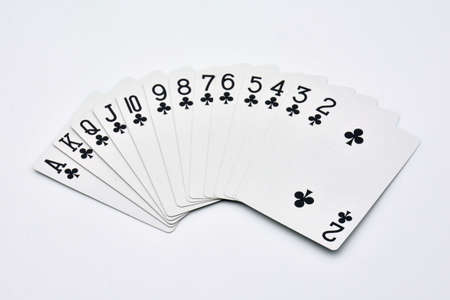 Clubs cards fanned out on white background