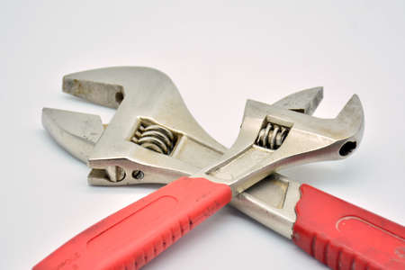 Tools, large and small adjustable wrench on white background