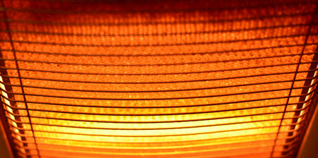 Detail of the screen of a halogen radiator turned on