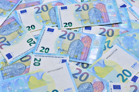 Many 20 euro bills on top of a table
