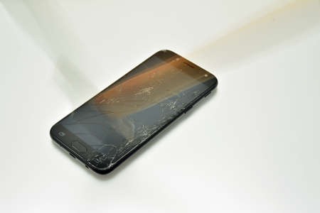 Hammer hitting mobile phone screen