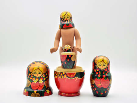 Russian dolls, matrioskas, put in different ways, isolated over white