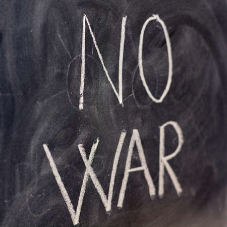 No to war, written with a chalk on the blackboard