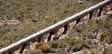 water pipe on slope in the field