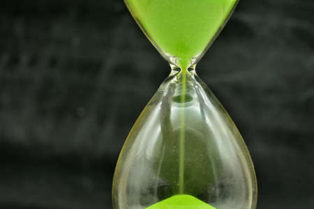 Detail of a green hourglass telling the timeの写真素材
