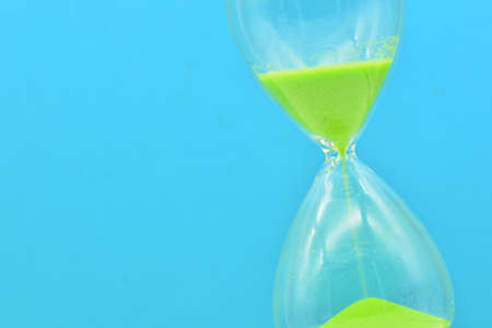 Detail of a green hourglass telling the timeの写真素材