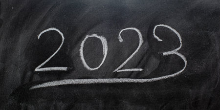 Year 2023 written on a blackboard with chalk