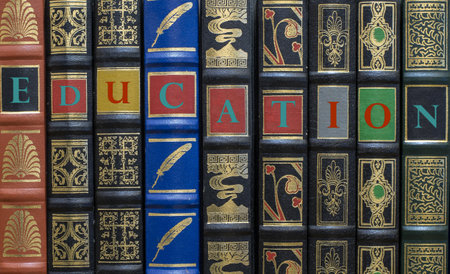 Classic book spines with the word education written on it