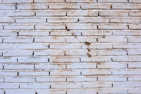 Wall made with white stained bricks, textureの写真素材