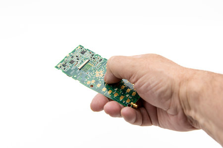 Hand holding an artificial intelligence remote control