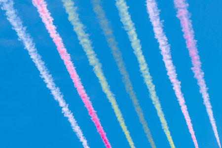 Contrails of colors in the sky after the passage of planes
