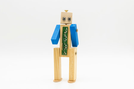 Small original robot made with wood and screws, isolated on whiteの写真素材