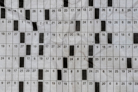 Detail of a hobbies, literary cabal, on a crumpled paper newspaperの写真素材