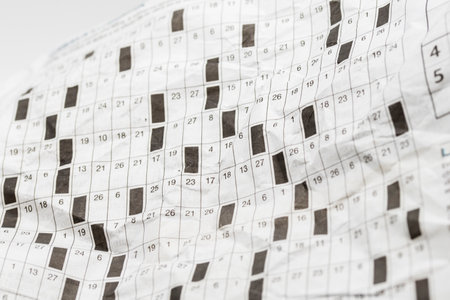 Detail of a hobbies, literary cabal, on a crumpled paper newspaperの写真素材