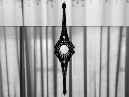 Backlit silhouette of a miniature Eiffel Towerの写真素材