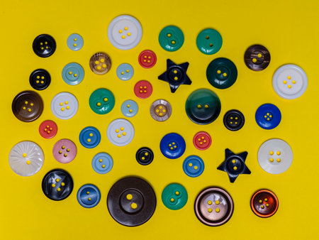 Regular buttons of various sizes, colors, shapes and materials