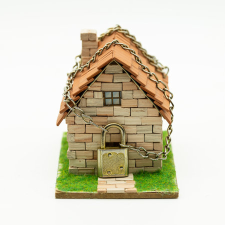 House locked with chain and padlock, isolated on whiteの写真素材