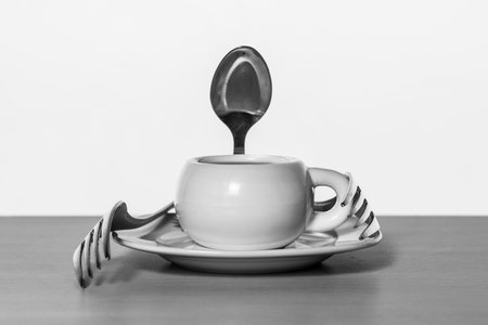 Cup of coffee with spoon and forks in black and whiteの写真素材