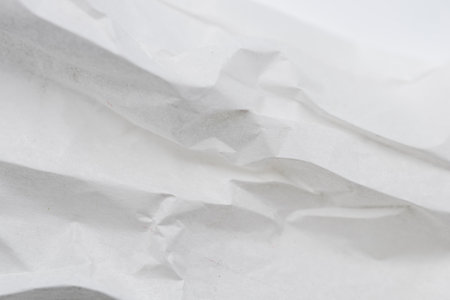 Detail of a crumpled piece of white paper, textureの写真素材
