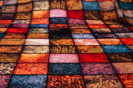 Checkered fabric tablecloth with a multitude of colors spread out, textureの写真素材