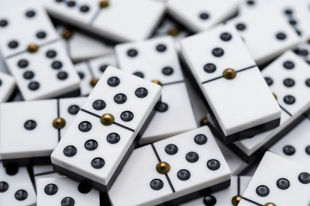 Detail of several domino pieces stacked together, highlighting one