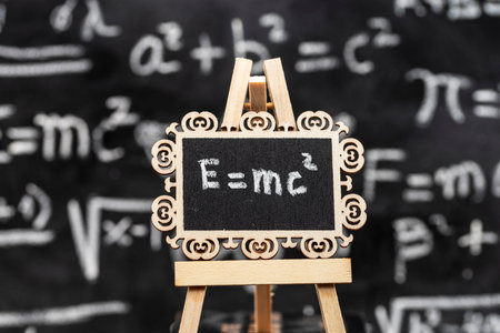 Einstein's general relativity formula written in chalk on a blackboardの写真素材