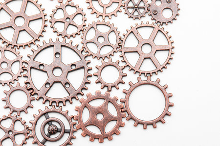 Copper and bronze metal gears, isolated on white