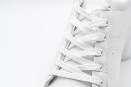 Detail of the laces of a sneaker, isolated on white