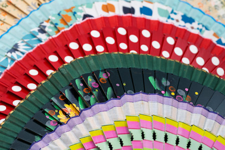 Traditional Spanish open wooden fans, painted with different motifs and colors