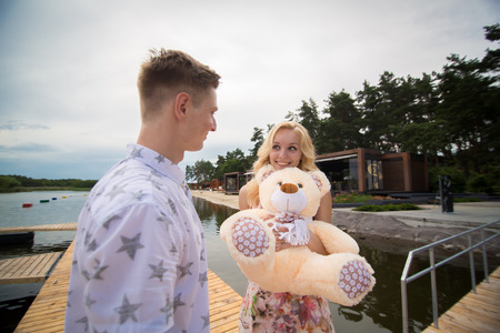 the guy gave a girl on a date at the pierの写真素材