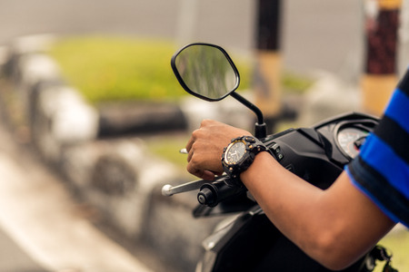 scooter driver hand on barの写真素材