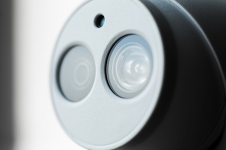 White security cctv dome type camera close-up. Lens and ir.