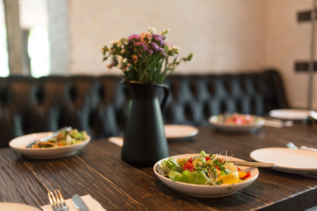 Fresh healty salad plate on wooden table.の写真素材