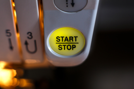 Close-up of a sewing machine button. workplace tailor. sewing industry.の写真素材
