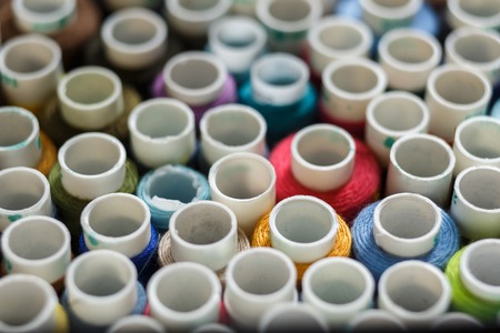 top view on closeup set of skeins of multi-colored sewing thread.Tailor industry.の写真素材