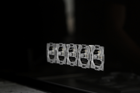 Five outlets in line, disassembled and mounted in black glass wall.の写真素材