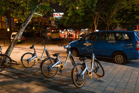 Kuala Lumpur, Malaysia - 13th February, 2018: Kuala Lumpur night street with bicycle parking lot.のeditorial素材