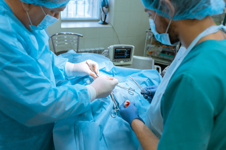 Group of surgeons in operating room with surgery equipment. Medical background.の写真素材