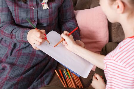 Teen girl on reception at the psychotherapist. Psychotherapy session for children. The psychologist...