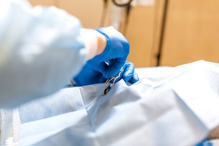 A professional ophthalmologist performs eye surgery with a microscope. The doctor inserted the...