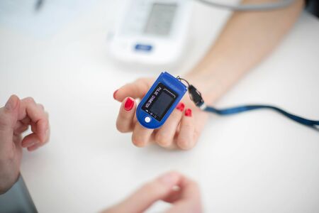 The sensor measuring the pulse and oxygen in the blood on the finger.