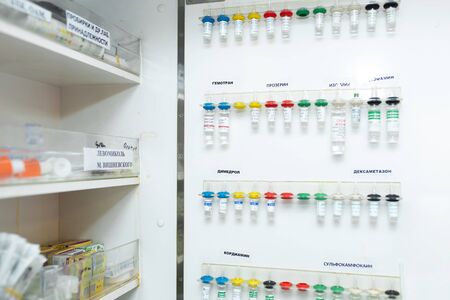 Opened aid box in ambulance with dropper tools, parts and drugs.の写真素材