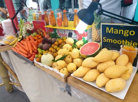 Street food vendor in Bangkok. wheelbarrow with fruits, vegetables and herbs.のeditorial素材