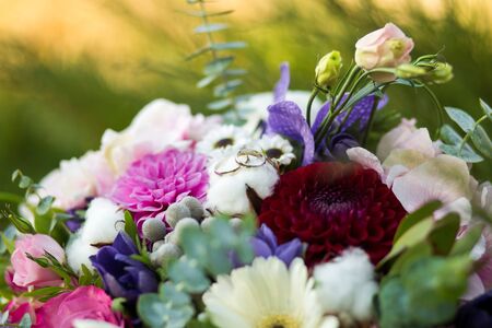 colored bouquet of fresh flowers on a green lawn.